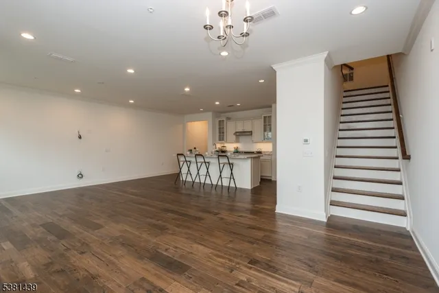 a view of kitchen with furniture and wooden floor