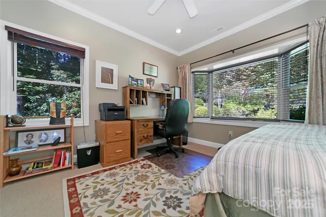 a bed room with a bed and a book shelf