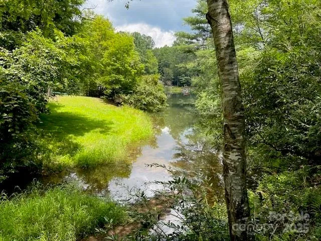 a view of a lake with a yard