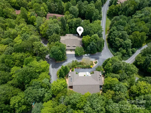 an aerial view of a house with a yard and garden