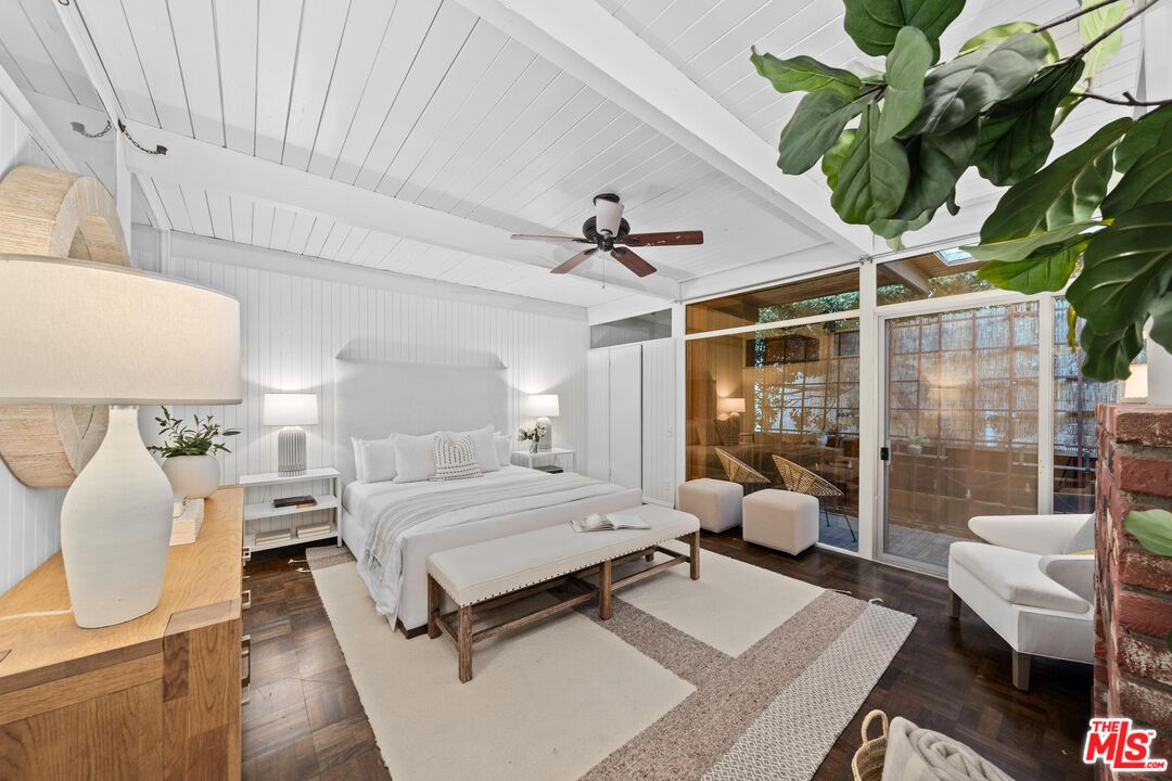 11612 Chenault Street, Unit 4 Los Angeles, CA 90049 - Photo 14 of 28 a bedroom with a bed and ceiling fan