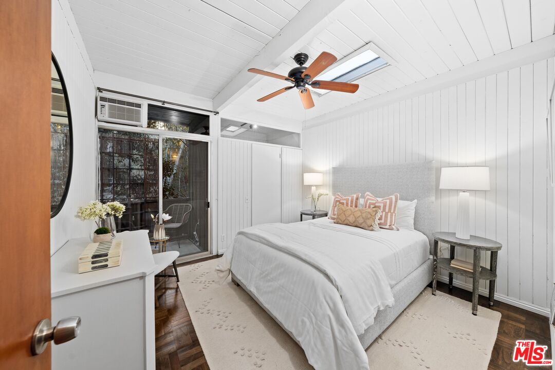 11612 Chenault Street, Unit 4 Los Angeles, CA 90049 - Photo 20 of 28 a bedroom with a bed and a window