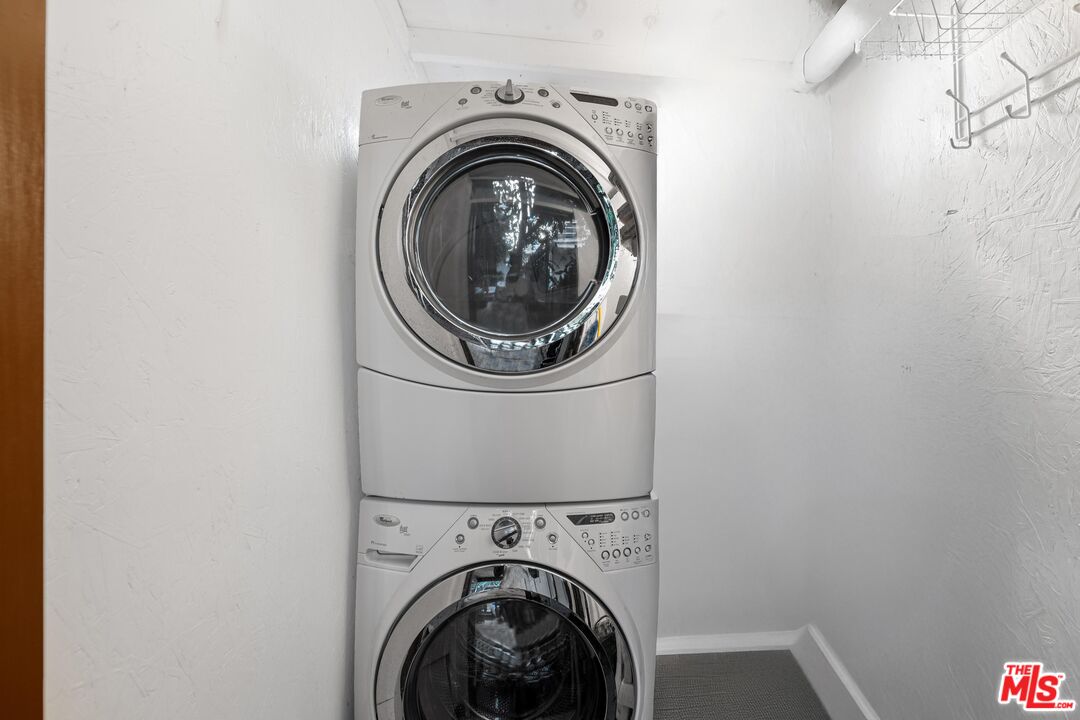 11612 Chenault Street, Unit 4 Los Angeles, CA 90049 - Photo 21 of 28 a utility room with dryer and washer