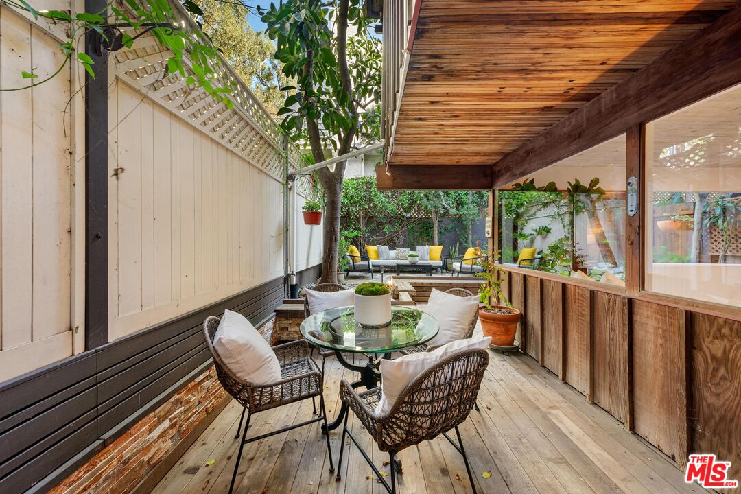 11612 Chenault Street, Unit 4 Los Angeles, CA 90049 - Photo 22 of 28 a view of a chairs and table in the balcony