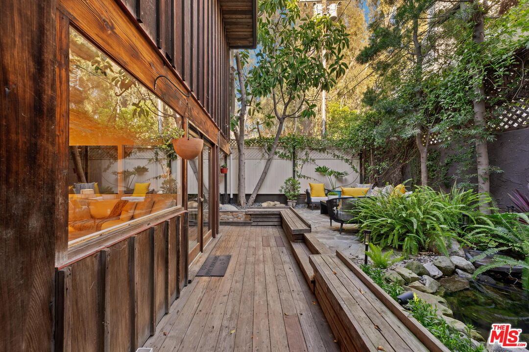 11612 Chenault Street, Unit 4 Los Angeles, CA 90049 - Photo 27 of 28 a view of a balcony with wooden floor