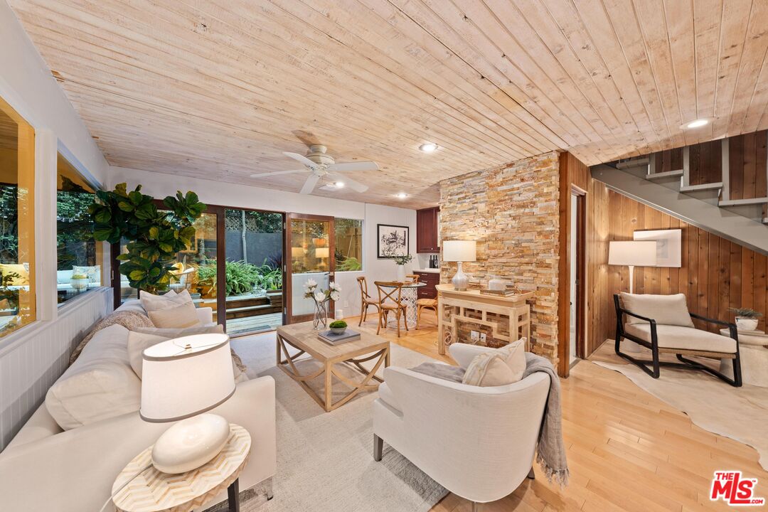 11612 Chenault Street, Unit 4 Los Angeles, CA 90049 - Photo 8 of 28 a living room with furniture and a large window