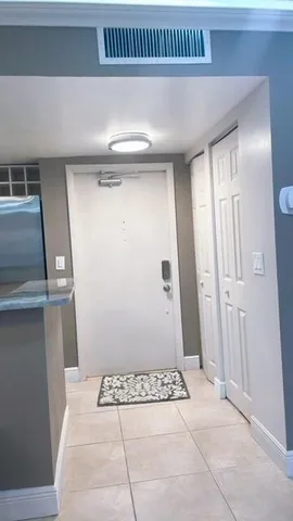 a bathroom with a double vanity sink and mirror