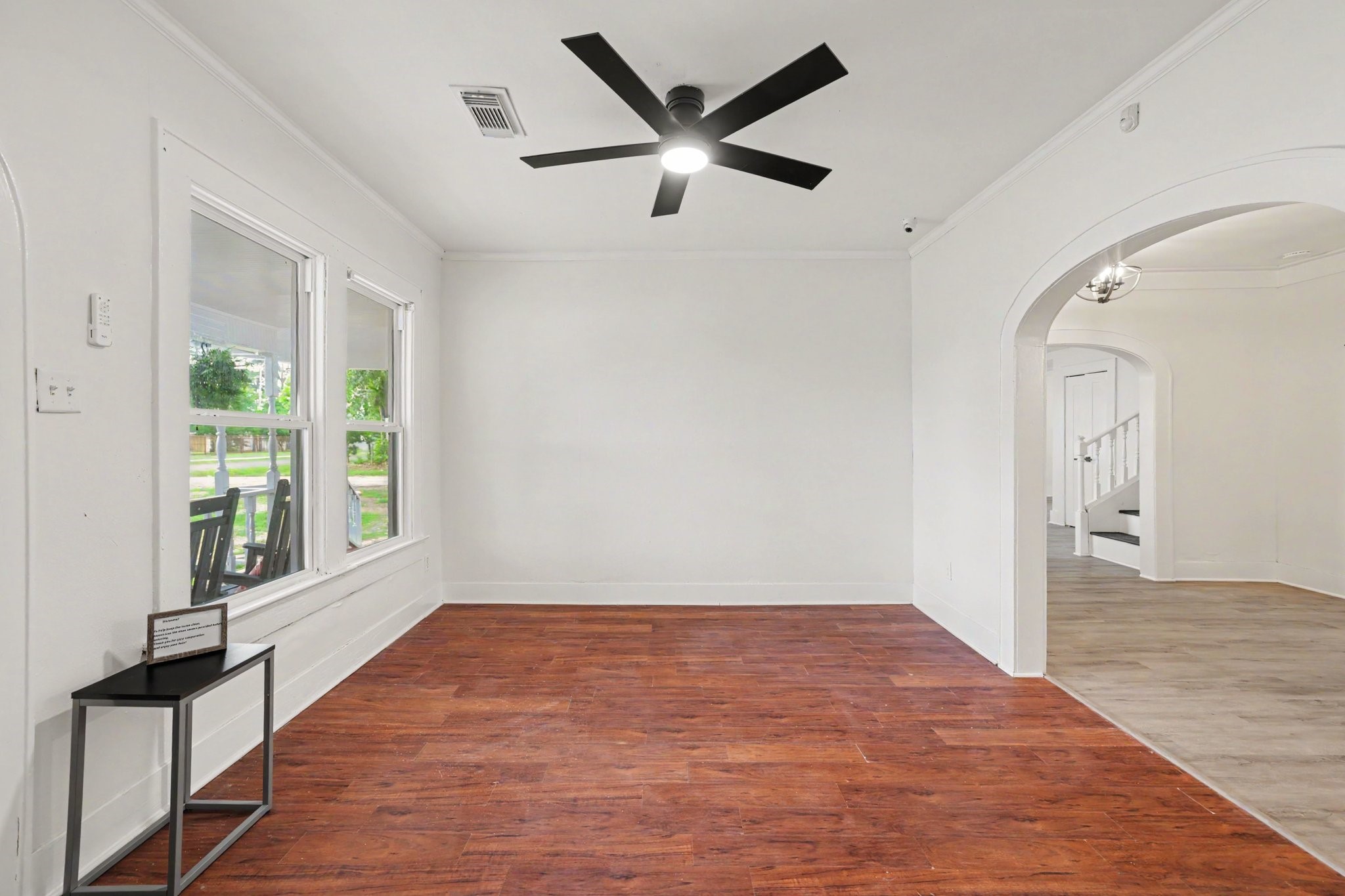 31730 Waller Tomball Road Waller, TX 77484 - Photo 13 of 50 This room features a bright, airy space with large windows and an elegant archway.