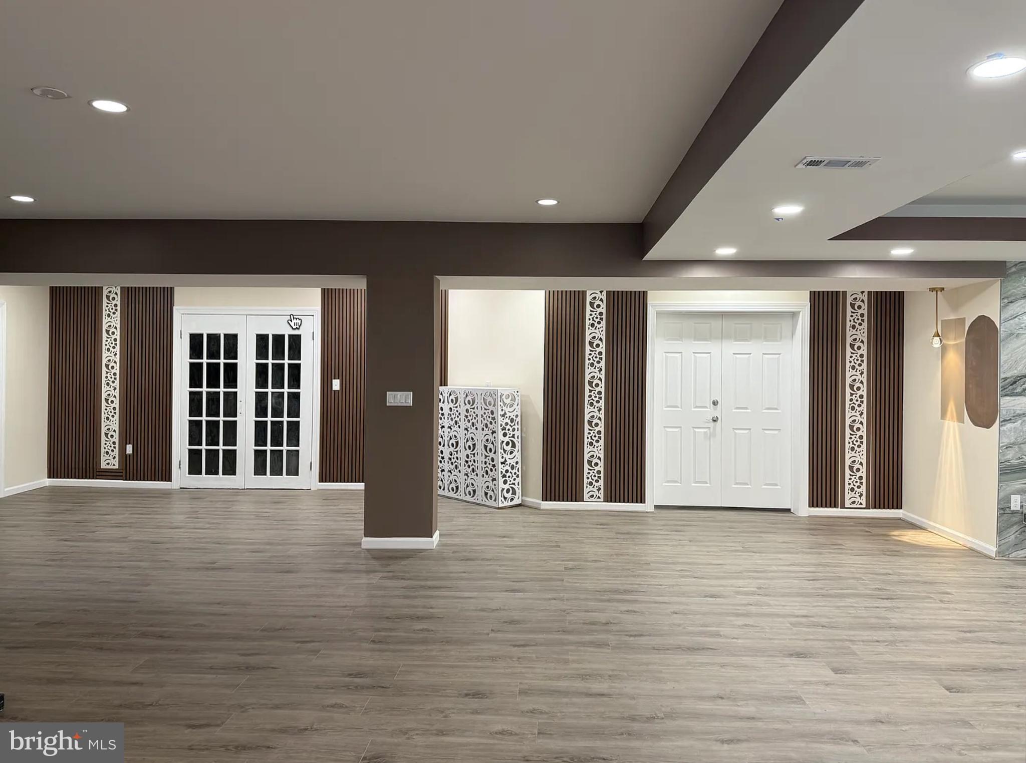 6038 Doyle Road Clifton, VA 20124 - Photo 11 of 20 a view of an empty room with wooden floor and a window