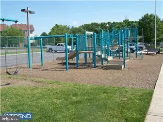 a view of a park with swings