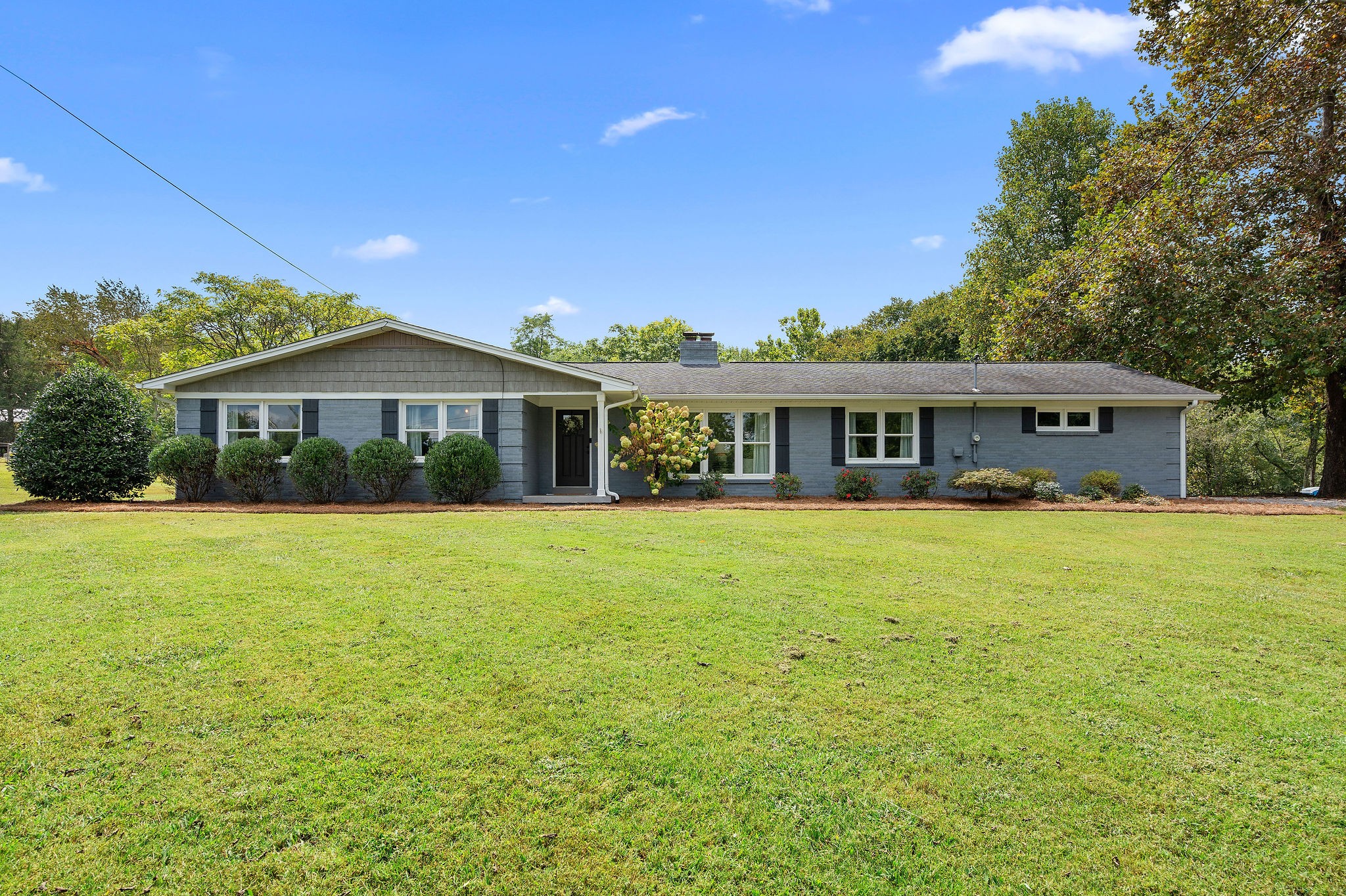 2337 Les Robinson Road Columbia, TN 38401 - Photo 1 of 35 a front view of a house with a garden