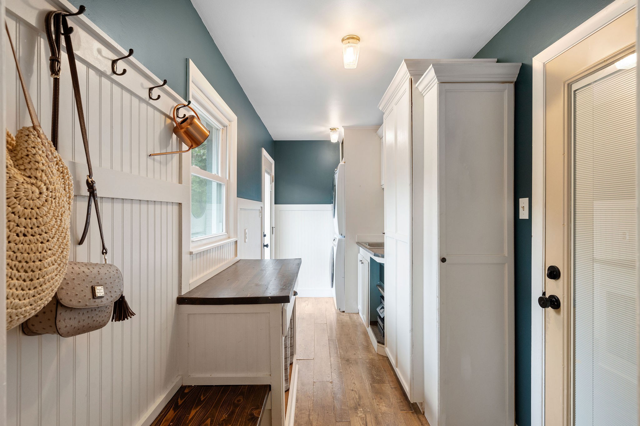 2337 Les Robinson Road Columbia, TN 38401 - Photo 17 of 35 a hallway with white cabinets and wooden floor