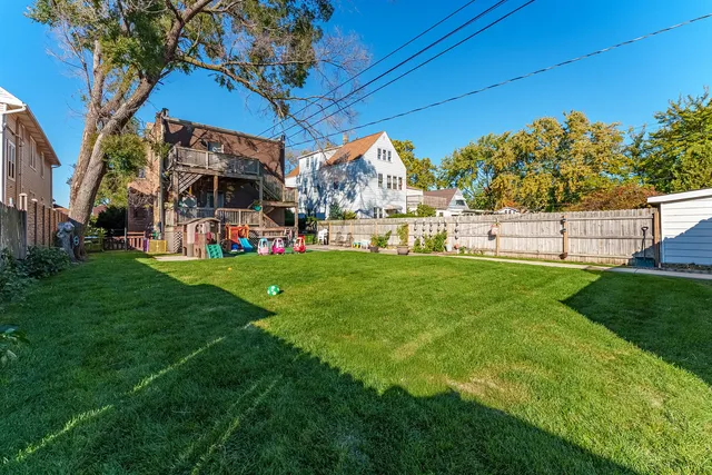 a view of a house with a back yard