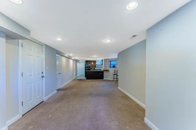 a view of a hallway to a bedroom