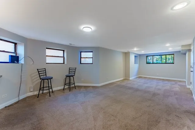 a view of a livingroom with furniture and windows
