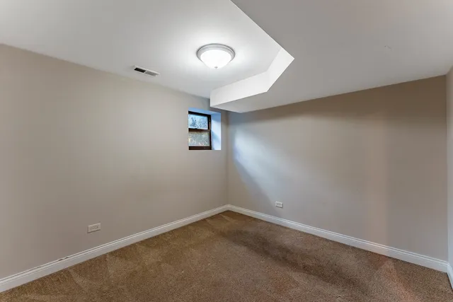 an empty room with windows and natural light
