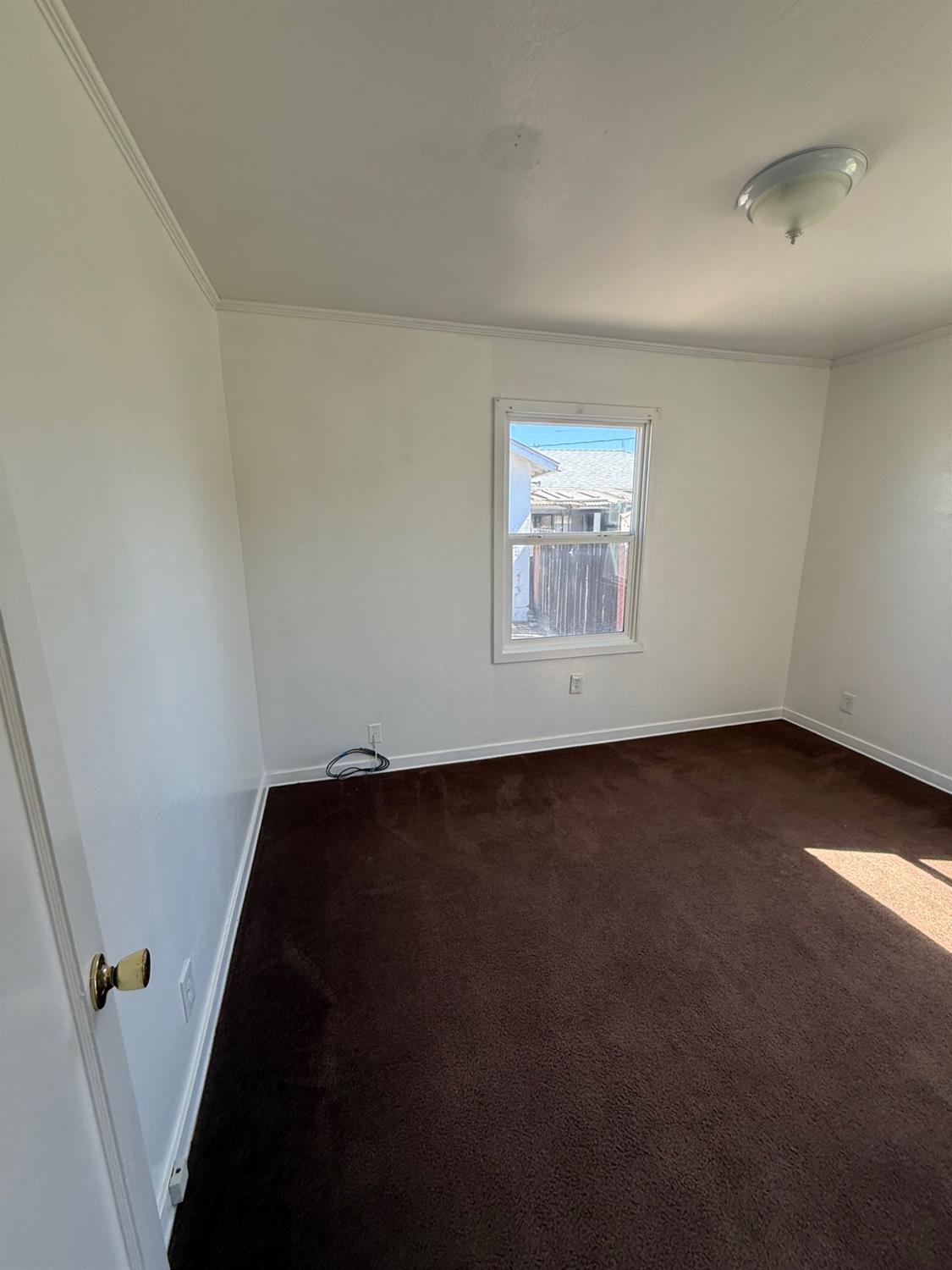 501 Rotan Avenue Madera, CA 93637 - Photo 10 of 23 an empty room with a window