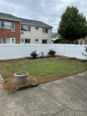 a view of a patio with a big yard