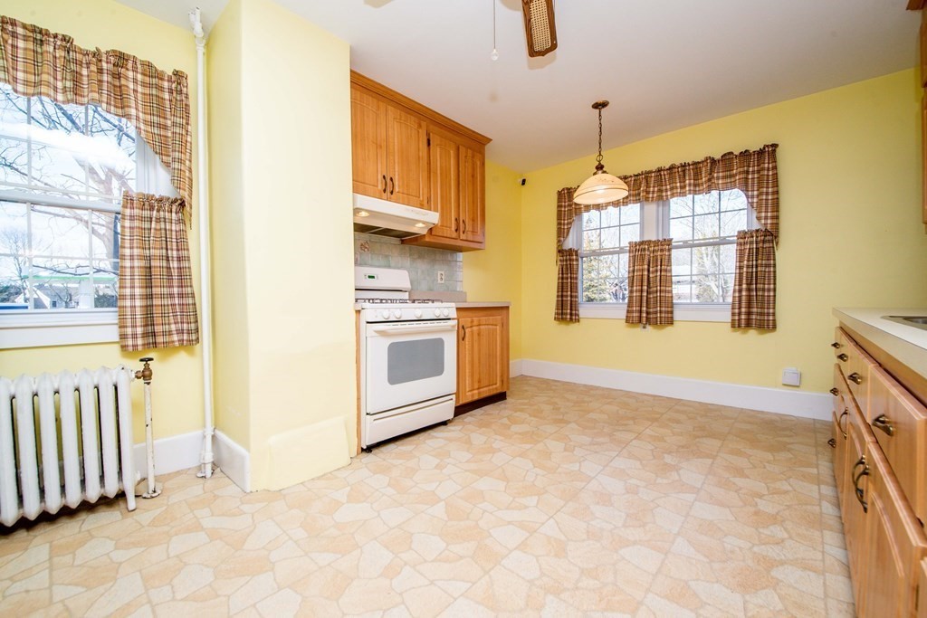 236 Russells Mills Road Dartmouth, MA 02748 - Photo 15 of 30 a view of an empty room with a fireplace and a window