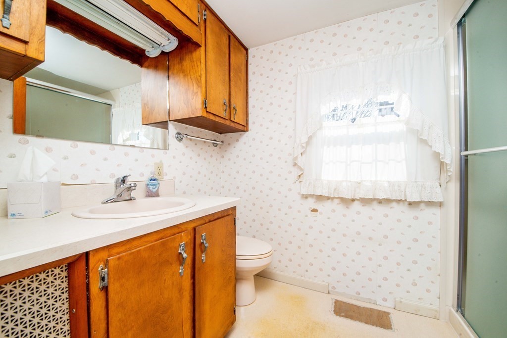 236 Russells Mills Road Dartmouth, MA 02748 - Photo 16 of 30 a bathroom with a sink and a mirror