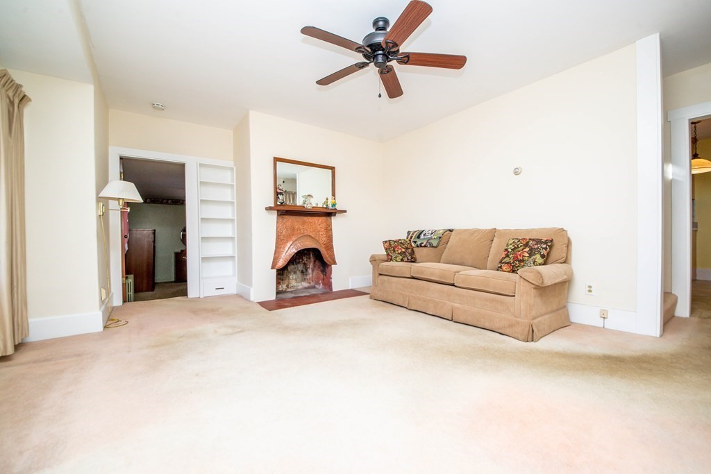 236 Russells Mills Road Dartmouth, MA 02748 - Photo 18 of 30 a living room with furniture and a flat screen tv
