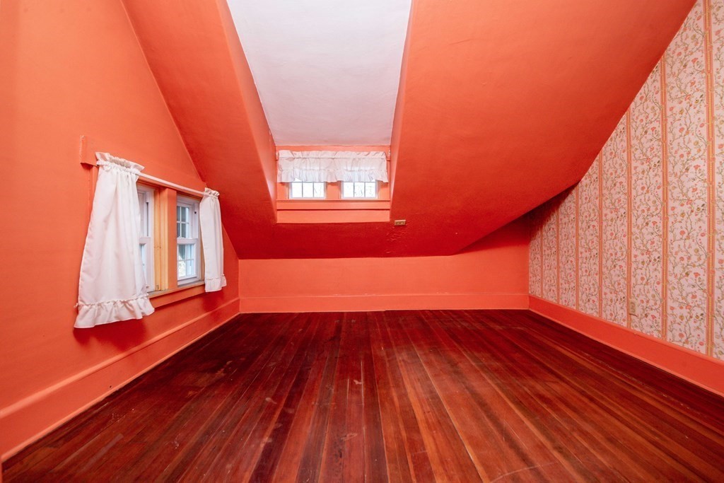 236 Russells Mills Road Dartmouth, MA 02748 - Photo 23 of 30 a view of an empty room with wooden floor and a window