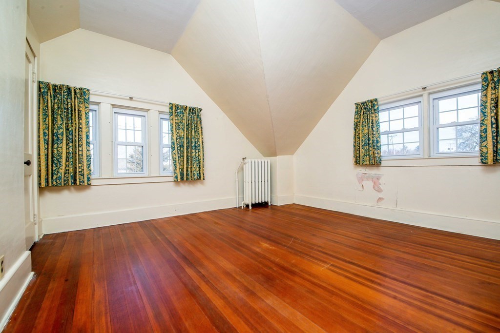 236 Russells Mills Road Dartmouth, MA 02748 - Photo 25 of 30 a view of an empty room with wooden floor and a window