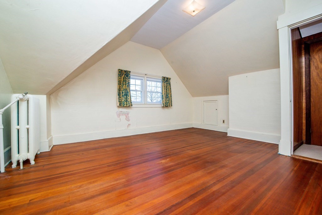 236 Russells Mills Road Dartmouth, MA 02748 - Photo 26 of 30 an empty room with wooden floor and windows