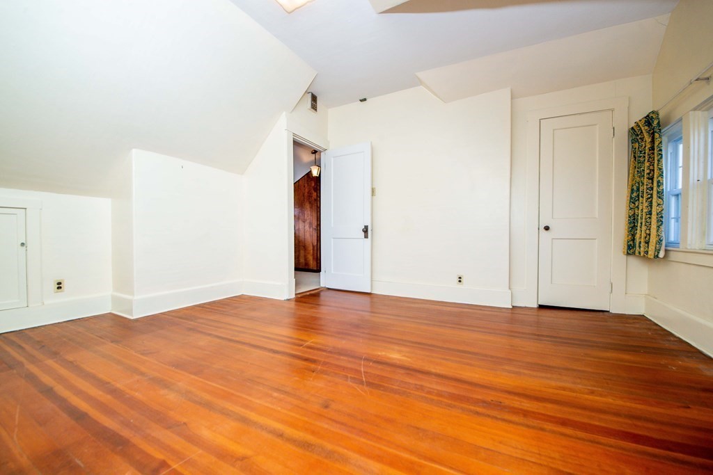 236 Russells Mills Road Dartmouth, MA 02748 - Photo 27 of 30 a view of an empty room with wooden floor and a window