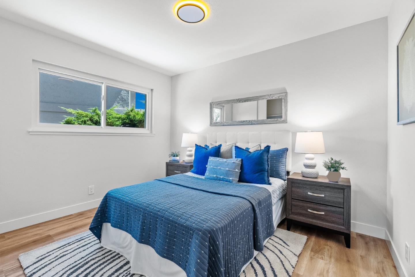 3763 Xavier Court Campbell, CA 95008 - Photo 23 of 41 a bedroom with a bed and a wooden floor