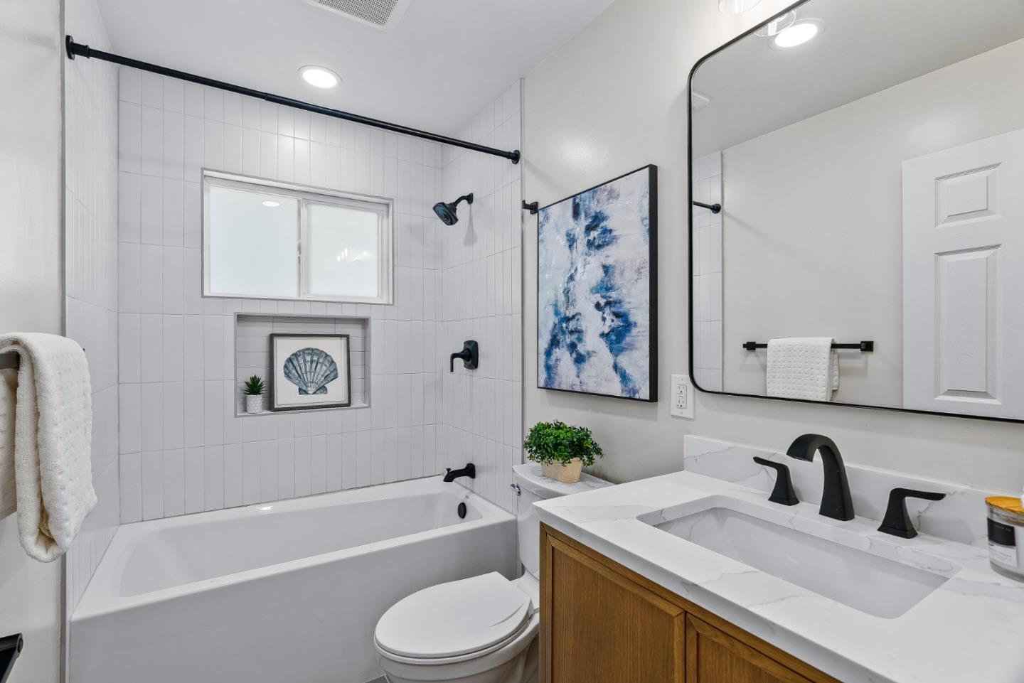 3763 Xavier Court Campbell, CA 95008 - Photo 24 of 41 a bathroom with a granite countertop sink a toilet and bathtub