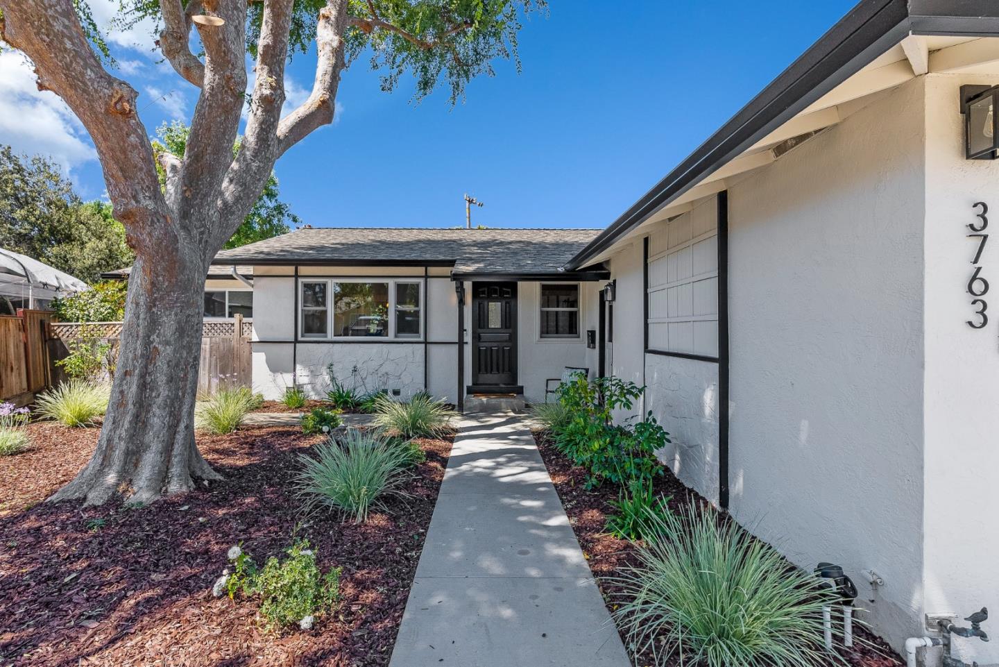 3763 Xavier Court Campbell, CA 95008 - Photo 5 of 41 a front view of a house with garden