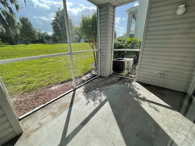a view of a garden with a wooden deck