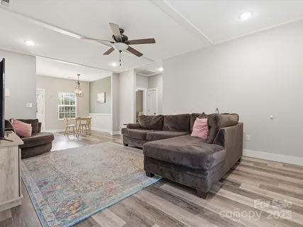 a living room with furniture and a rug