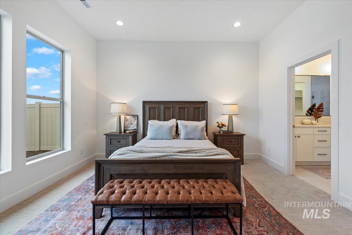 1297 Chena Street Middleton, ID 83644 - Photo 23 of 38 Bedroom with light carpet, recessed lighting, and ensuite bath