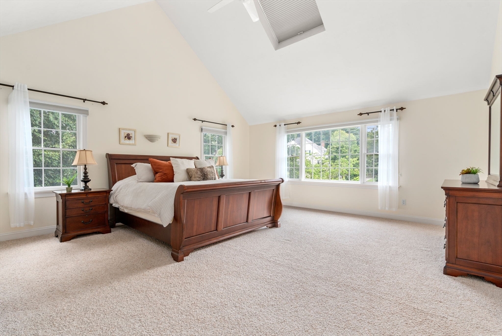 8 Stoneybrook Circle Andover, MA 01810 - Photo 16 of 37 a bedroom with a bed next to a large window