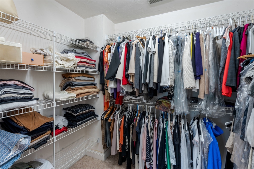 8 Stoneybrook Circle Andover, MA 01810 - Photo 18 of 37 a view of walk in closet with clothes