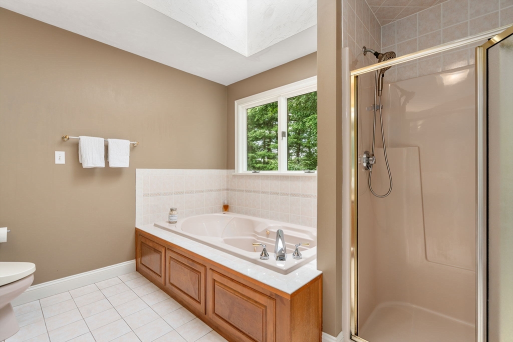 8 Stoneybrook Circle Andover, MA 01810 - Photo 20 of 37 a bathroom with a sink a toilet and shower