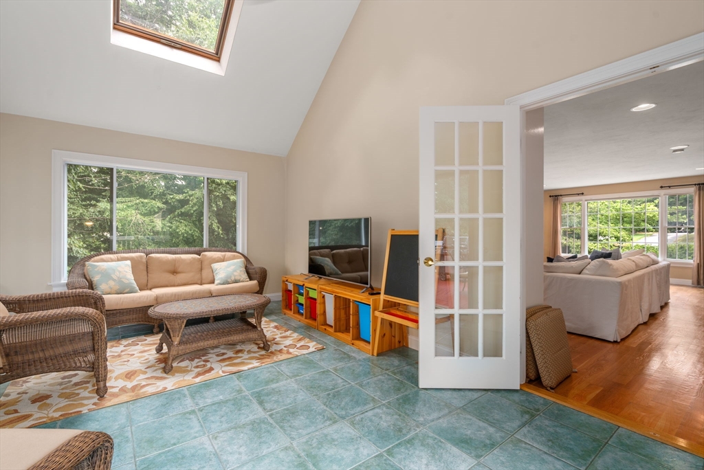 8 Stoneybrook Circle Andover, MA 01810 - Photo 27 of 37 a living room with furniture and a flat screen tv