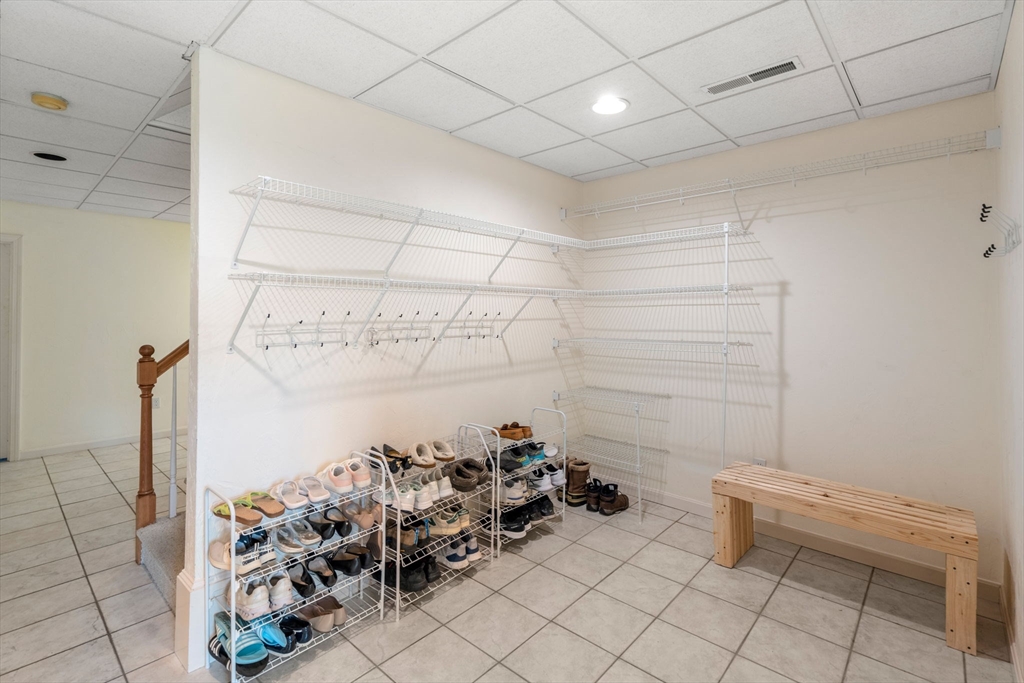 8 Stoneybrook Circle Andover, MA 01810 - Photo 29 of 37 a view of a room with racks on the wall