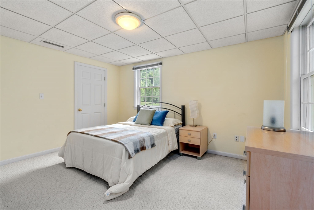 8 Stoneybrook Circle Andover, MA 01810 - Photo 31 of 37 a bedroom with a bed and a table