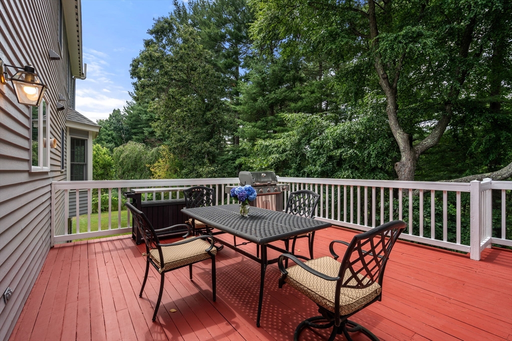 8 Stoneybrook Circle Andover, MA 01810 - Photo 34 of 37 a view of a wooden deck with furniture