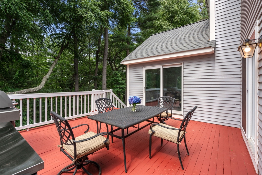 8 Stoneybrook Circle Andover, MA 01810 - Photo 35 of 37 a view of a patio with a table and chairs