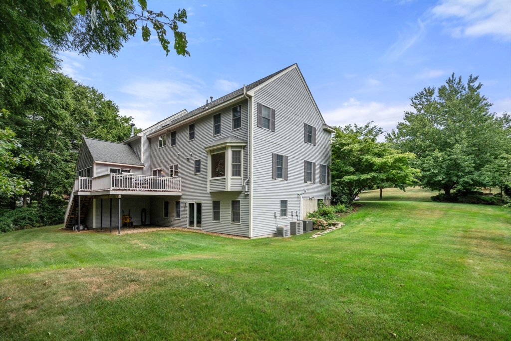 8 Stoneybrook Circle Andover, MA 01810 - Photo 36 of 37 a front view of house with yard and green space