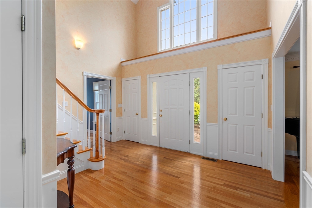 8 Stoneybrook Circle Andover, MA 01810 - Photo 5 of 37 a view of an entryway with wooden floor and staircase