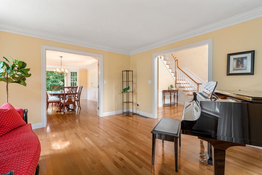 8 Stoneybrook Circle Andover, MA 01810 - Photo 7 of 37 a living room with furniture and a wooden floor