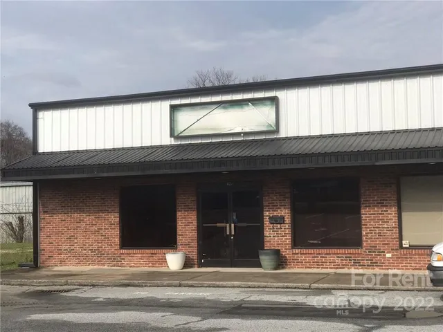 a view of a living room and entryway