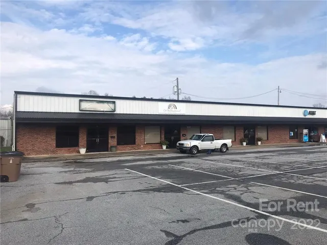 a view of parking area and car parked