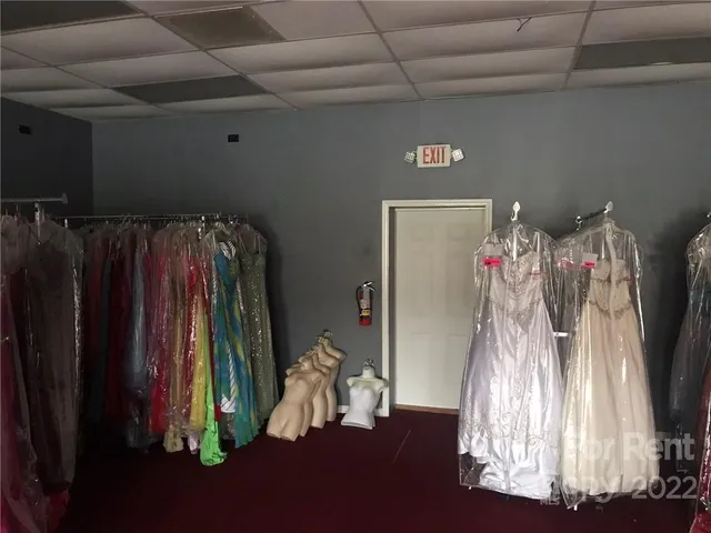 a view of walk in closet with clothes