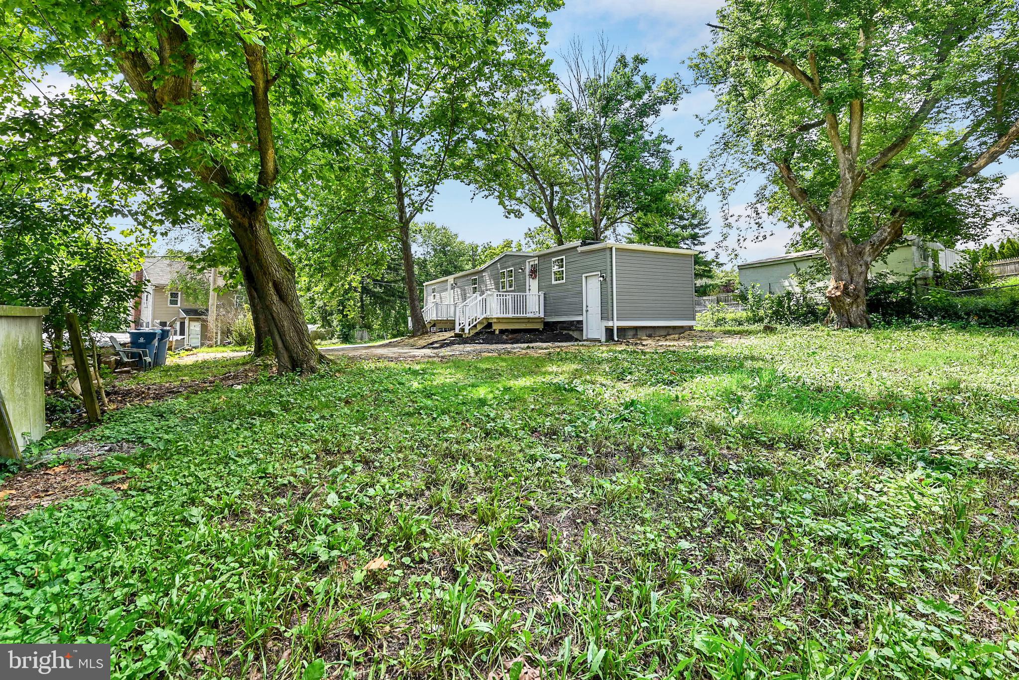 215 Freysville Road York, PA 17406 - Photo 17 of 19 a view of a house with a tree and a yard
